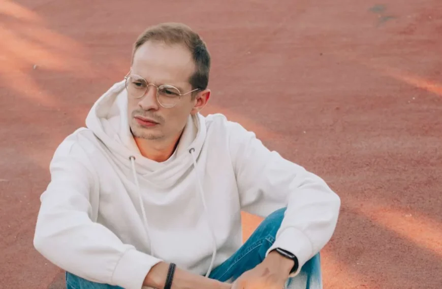 Young man exploring colorful streets of a bustling exotic city