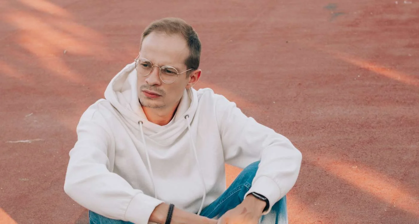 Young man exploring colorful streets of a bustling exotic city